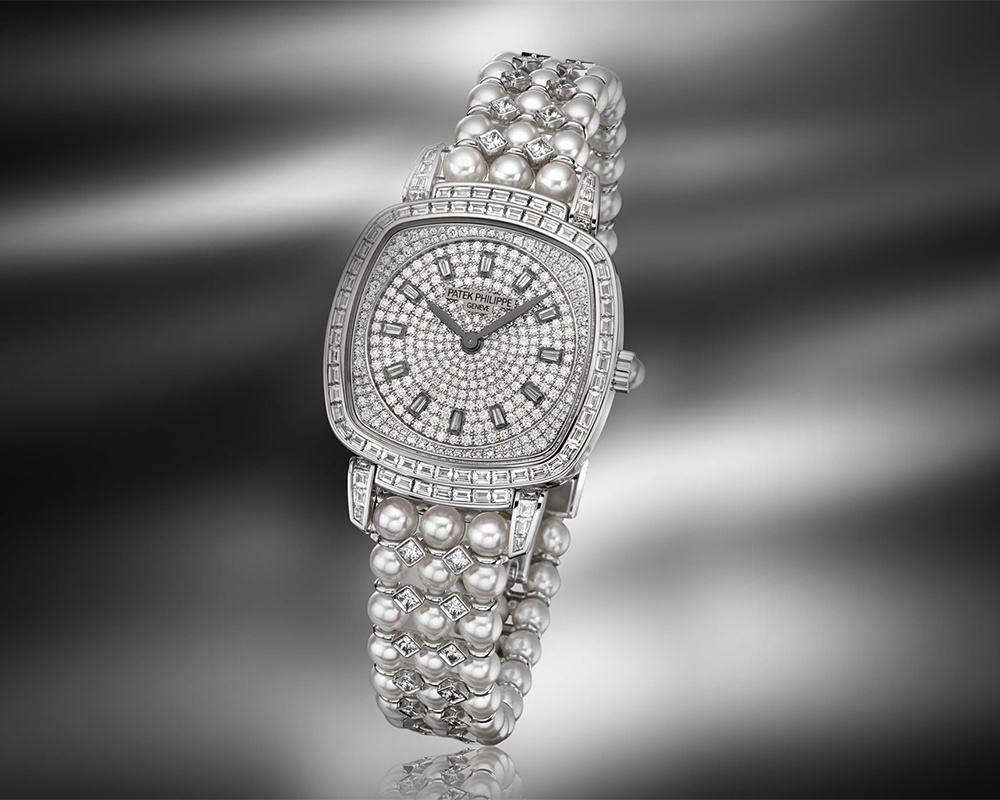 The Patek Philippe Ref. 7042/100G-010 Gondolo Haute Joaillerie offers a more dramatic presentation of the same watch-as-jewelry philosophy, clad in diamonds and pearls.